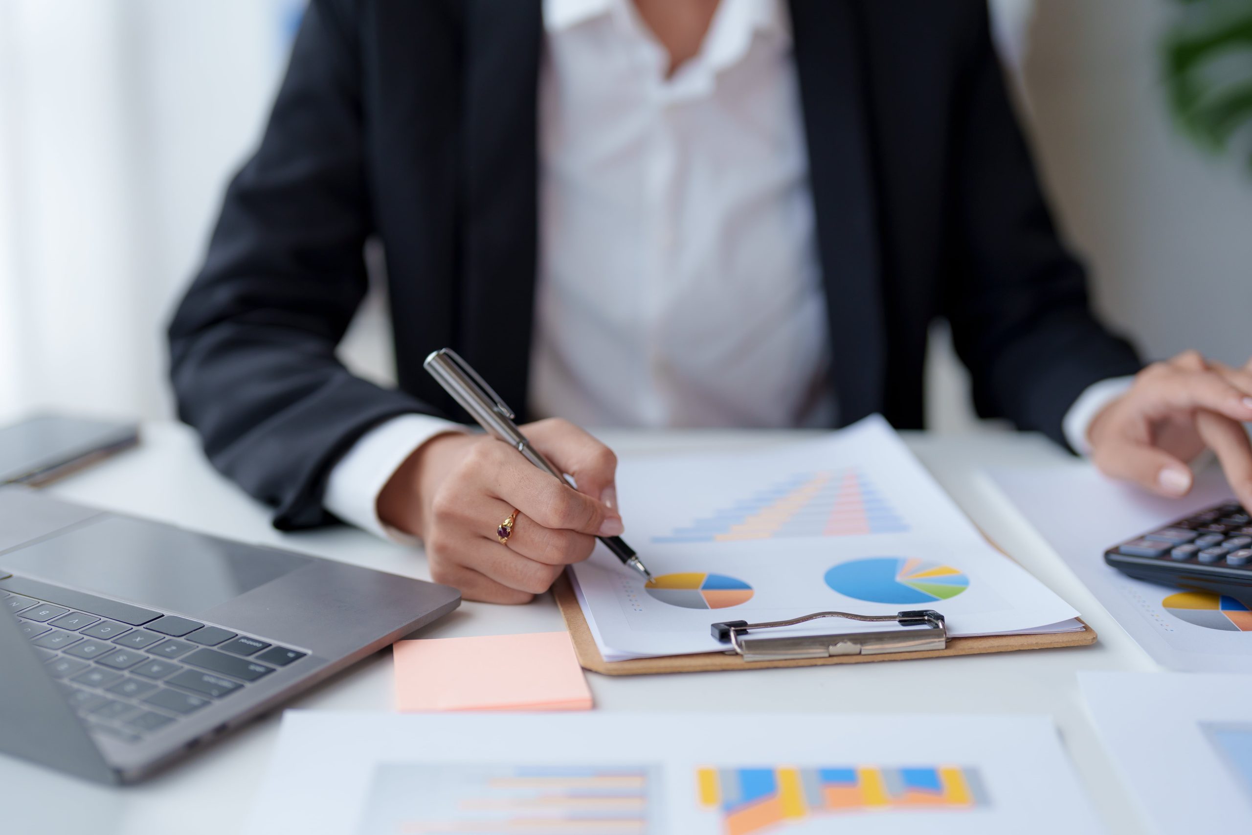 close-up-of-a-business-woman-s-hands-using-a-calcu-2023-01-30-23-44-25-utc-min